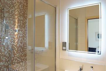 The beautifully tiled shower enclosure in the en suite shower-room.