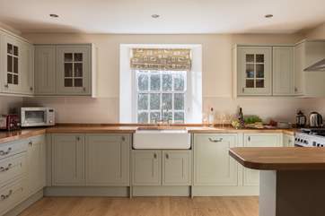 The lovely Shaker-style kitchen looks out over the garden.