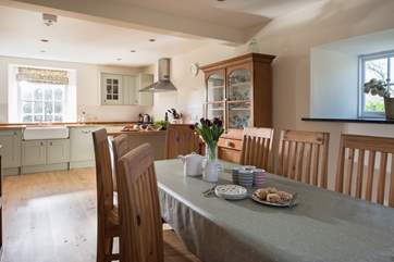 Light floods into the kitchen/dining-room throughout the day.