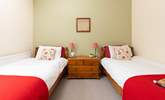 Calming tones of greens and reds in Bedroom 3.  - Thumbnail Image