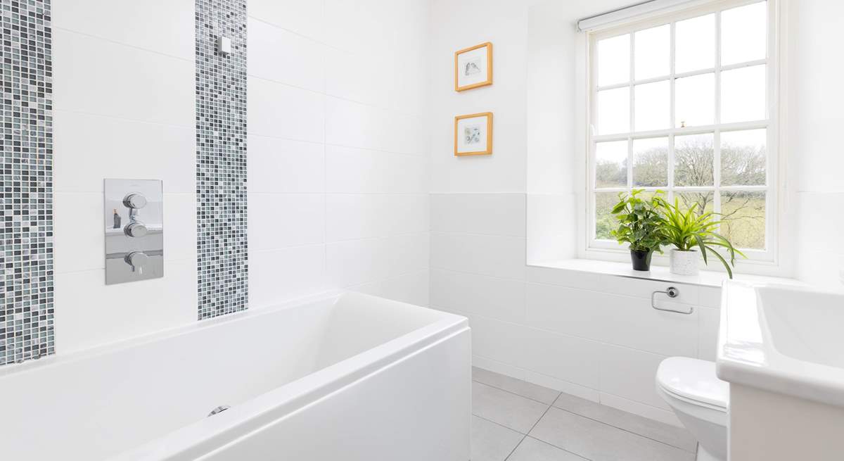 The family bathroom on the first floor, have a long soak watching the clouds pass by. 