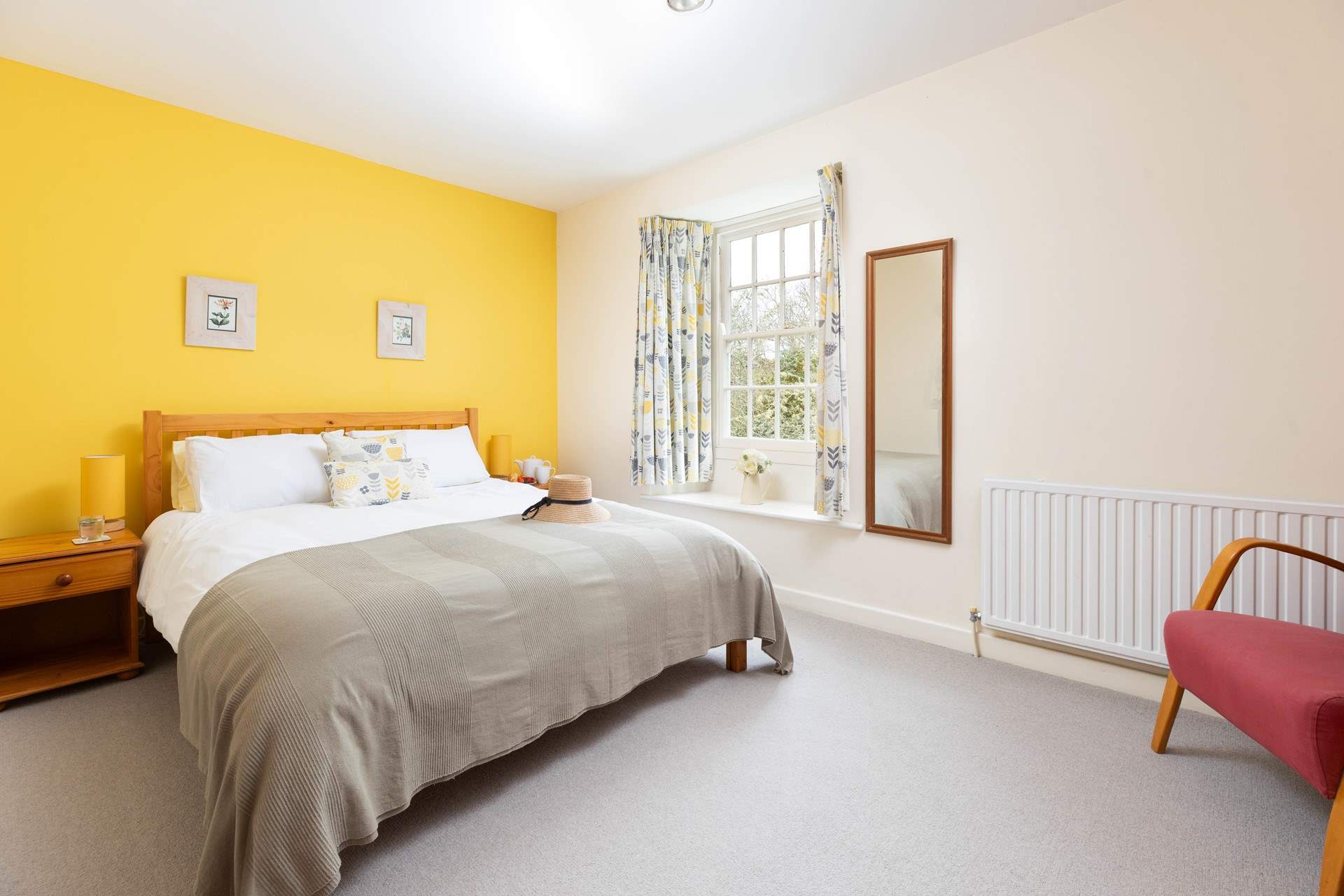 Bedroom two is decorated in warming tones. 