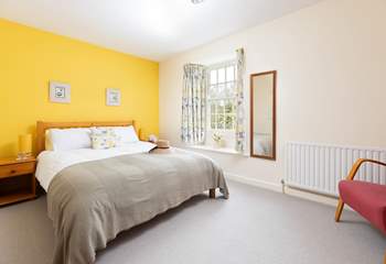 Bedroom two is decorated in warming tones. 