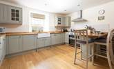 The shaker style kitchen over looks the pretty garden.  - Thumbnail Image