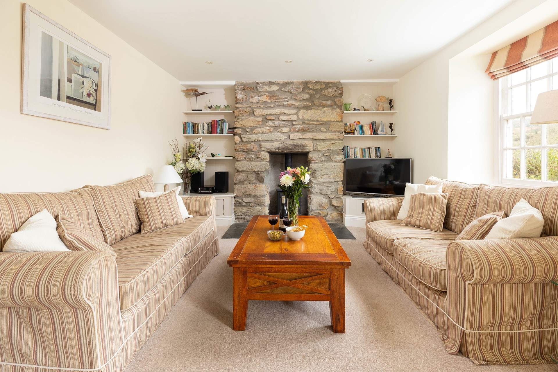 Time for a good film in front of the fire, the wood-burner effect gas stove adds warmth and a focal point.