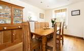 Enjoy long meals around the dining table at Higher Carnon Farmhouse.  - Thumbnail Image