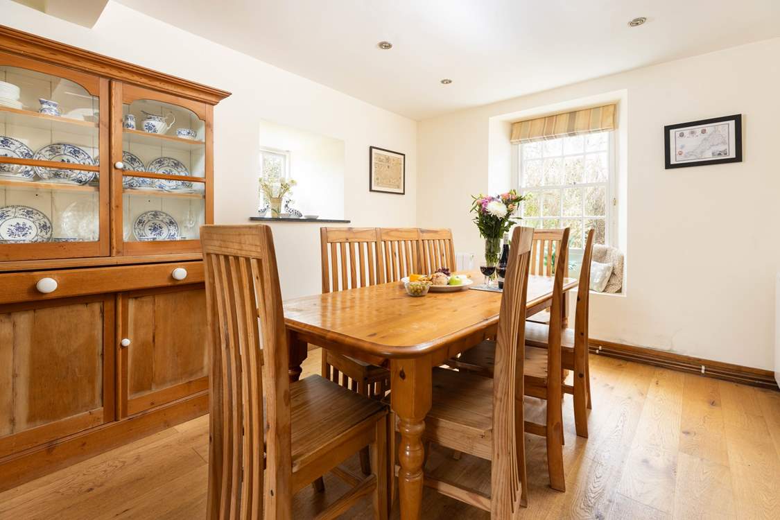 Enjoy long meals around the dining table at Higher Carnon Farmhouse.