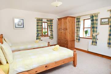 Storage and space in the rear twin bedroom.