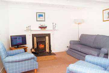 The cosy sitting-room with its traditional beamed ceiling.