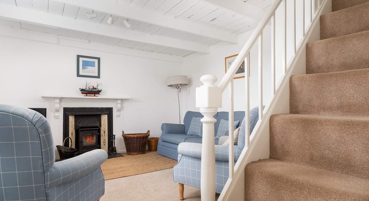 The cosy sitting-room with its traditional beamed ceiling.