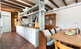 The lovely kitchen is the perfect spot for a family gathering.  - Thumbnail Image