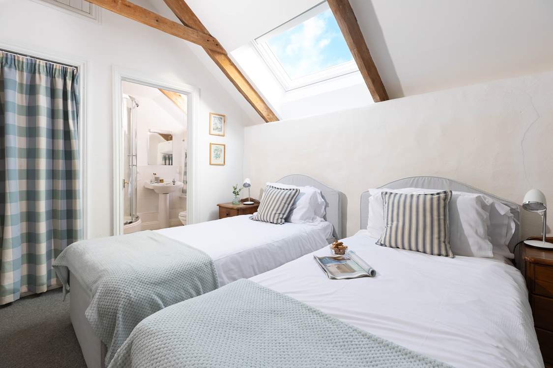 The pretty blue bedroom has an en suite shower-room (Bedroom 4).