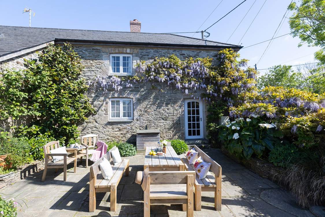 Enjoy long relaxing meals in the suntrap of a garden.