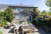 Enjoy long relaxing meals in the suntrap of a garden.