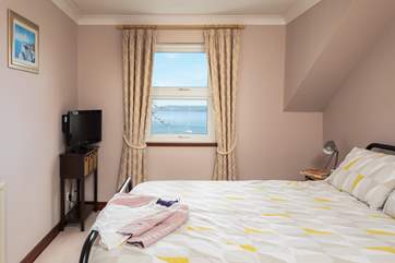 Bedroom 1 has a king-size (5') bed, small television and DVD player.