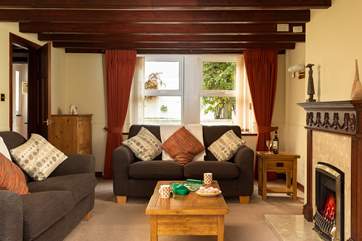 Comfortable sofas, a coal-effect gas fire and TV with Freesat...all perfect for family film nights.