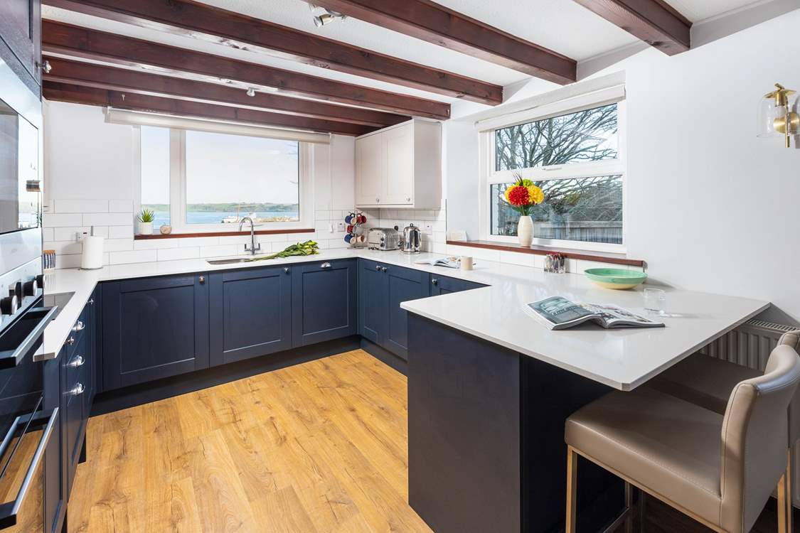 The kitchen has a useful breakfast-bar.