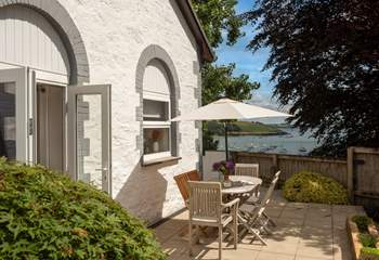 Double doors open to the wrap around terrace. 