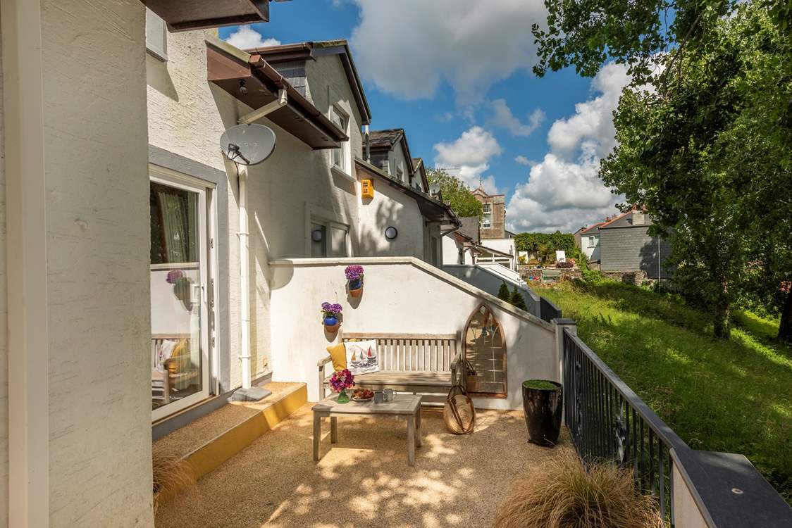 Enjoy a morning coffee tucked away in this sheltered spot.