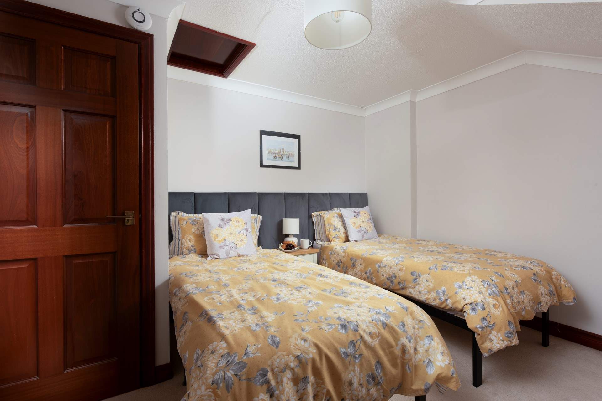 Bedroom 2 has single beds and this bedroom also looks out over the sea. 