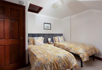 Bedroom 2 has single beds and this bedroom also looks out over the sea. 