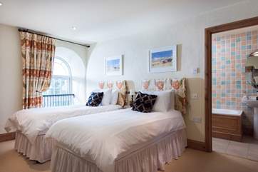 The twin bedroom (Bedroom 2) has an en suite bathroom.