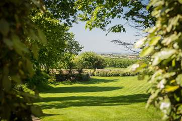 The enclosed garden comprises an acre of lawn and trees.