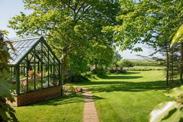 The garden is adjacent to the Owner's home which is behind the trees on the left of the picture.