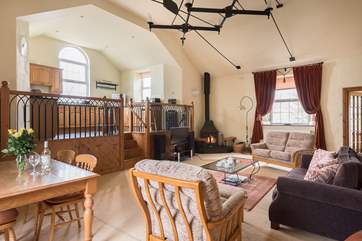 The beautifully furnished open plan living-room with dining-area.