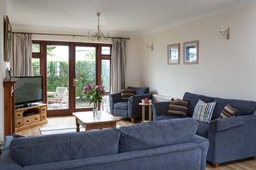 The spacious reception room with patio doors.