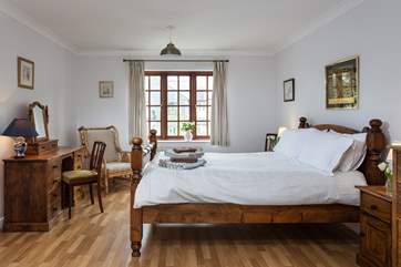 The master bedroom (Bedroom 1) on the first floor, has views over the front and back of the property.
