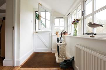The porch provides a perfect place for donning walking boots or drying soggy dogs!