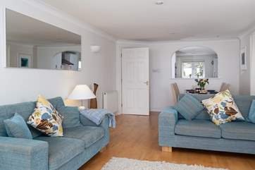 The sitting-room is furnished in beautiful pastel colours, which compliment the sea.