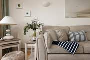 Restful and relaxing, the living area has been thoughtfully decorated taking inspiration from the coastal surroundings.