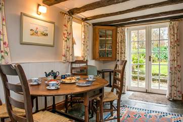 French doors from the dining-area lead out to the enclosed garden.