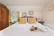 The cottage has two pretty bedrooms.