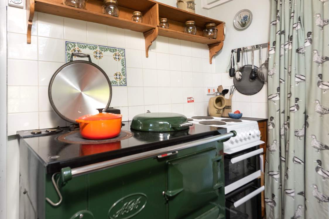 The lovely electric Aga creating a warm welcome all year round and there is an electric oven and hob too.