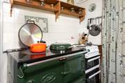 The lovely electric Aga creating a warm welcome all year round and there is an electric oven and hob too.