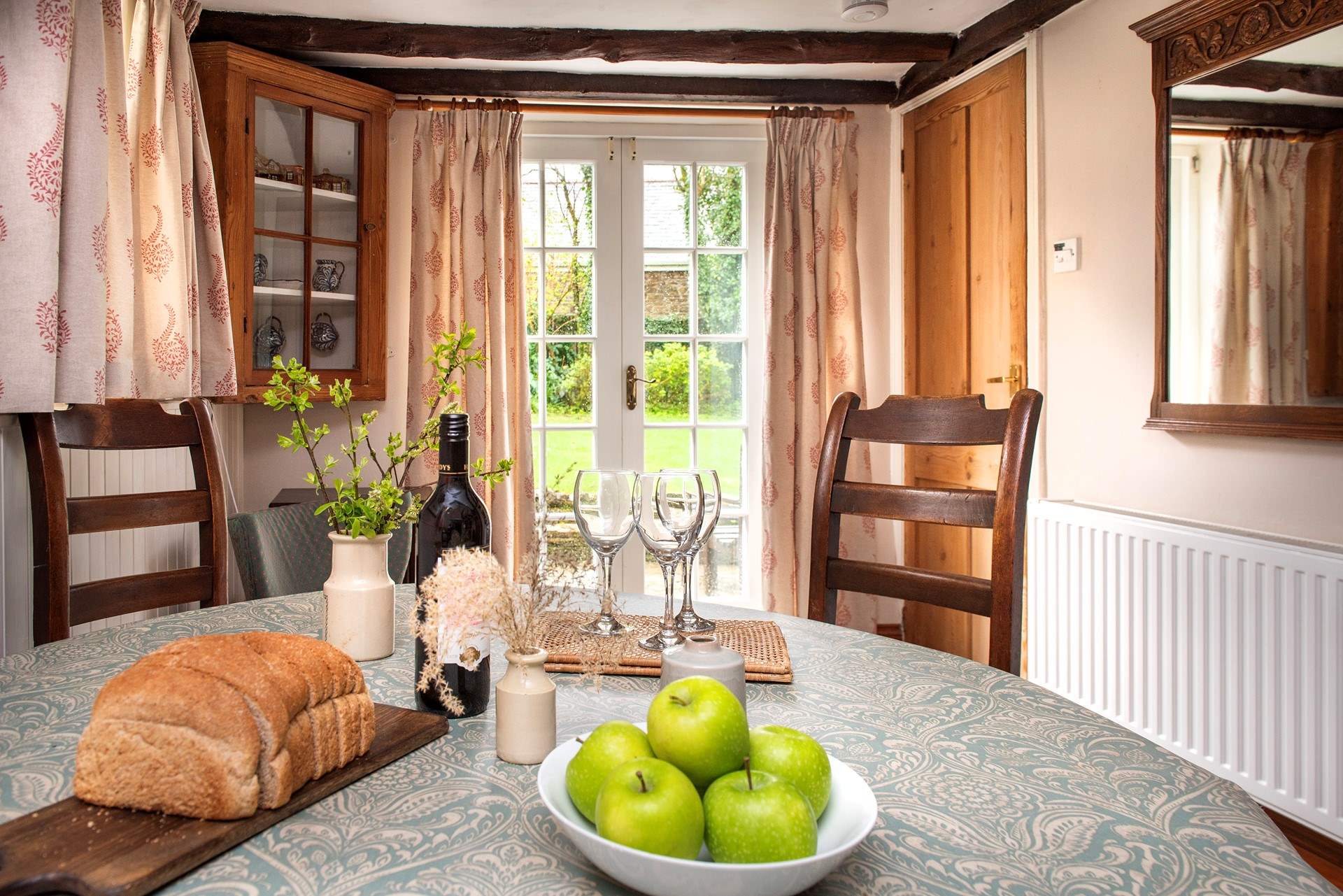 French doors from the dining-area lead out to the enclosed garden.