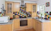 The bright and cheery kitchen has all that you need to create a light snack or a delicious feast. - Thumbnail Image