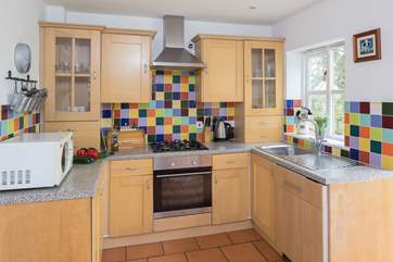 The bright and cheery kitchen has all that you need to create a light snack or a delicious feast.