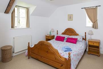 The master bedroom has a king-size bed and en suite bathroom (Bedroom 1).