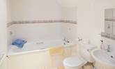 The en suite bathroom is spacious and light. - Thumbnail Image