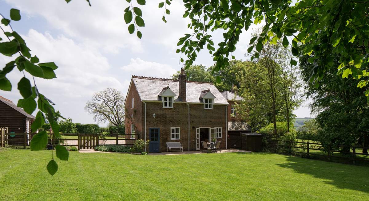 The cottage looks out onto the enclosed garden and has wonderful views, the owner's house is to the right in the background.