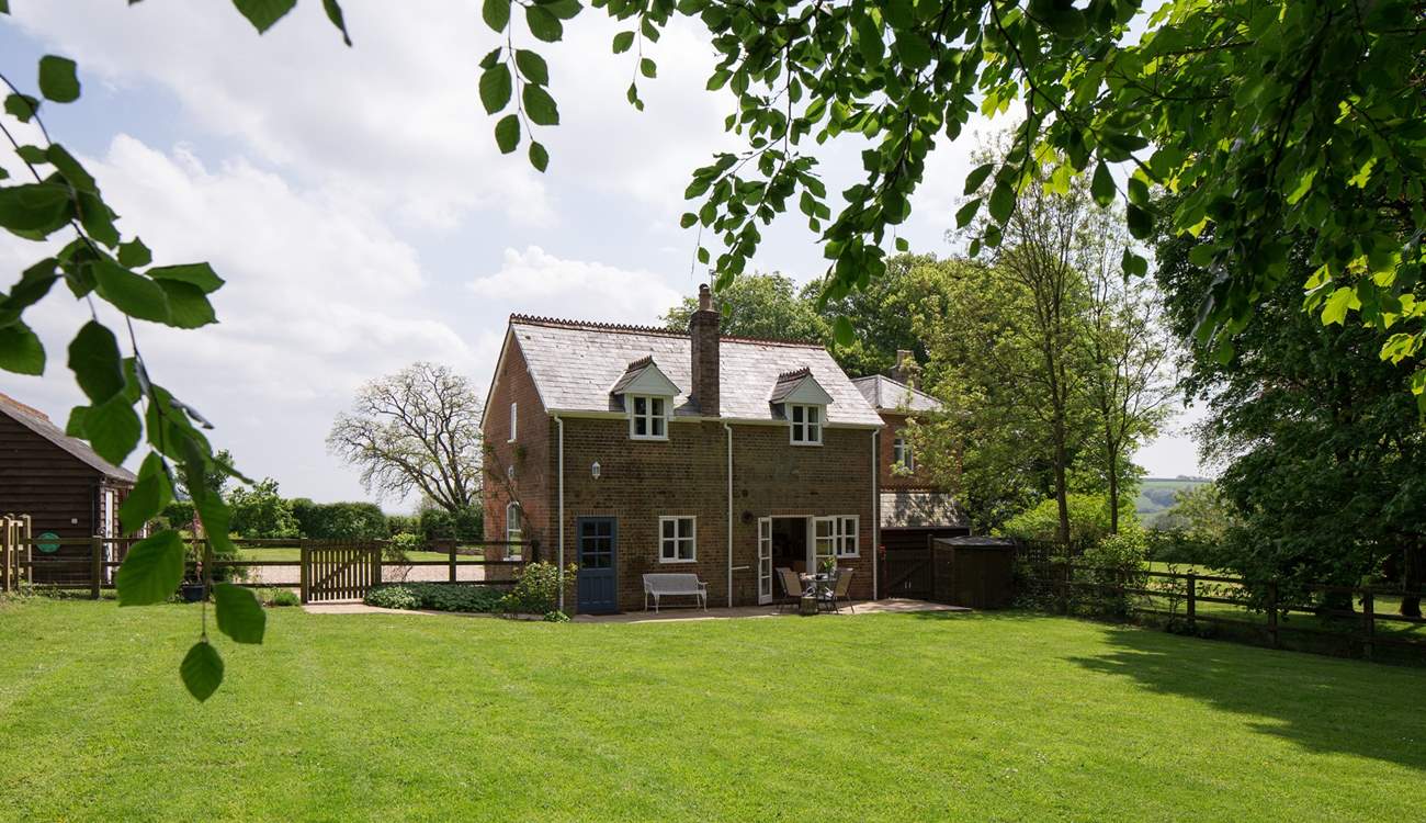 The cottage looks out onto the enclosed garden and has wonderful views, the owner's house is to the right in the background.