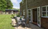 The private terrace at the back of the cottage has French doors that lead into the kitchen, perfect for al fresco dining. - Thumbnail Image