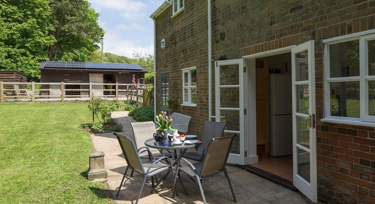 The private terrace at the back of the cottage has French doors that lead into the kitchen, perfect for al fresco dining.