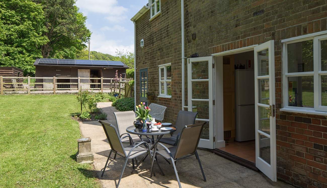 The private terrace at the back of the cottage has French doors that lead into the kitchen, perfect for al fresco dining.