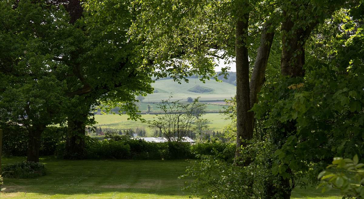 Wonderful views from the private garden through a copse and across the valley.