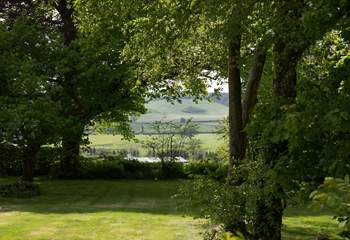 Wonderful views from the private garden through a copse and across the valley.